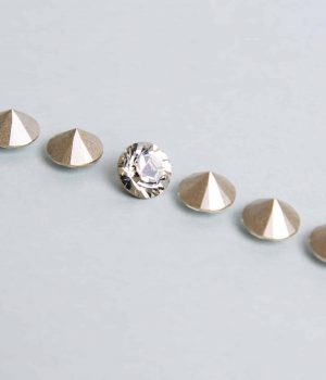 Jewellery. Few crystals on a gray background
